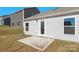 Side view of the backyard featuring a small concrete patio and exterior door at 4677 Fanning Rd, Hickory, NC 28602
