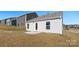 Backyard with an exterior back door, and a small concrete patio on a lot with green and brown grass at 4677 Fanning Rd, Hickory, NC 28602