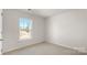 Bright bedroom with plush carpeting, a window overlooking the neighborhood at 4677 Fanning Rd, Hickory, NC 28602