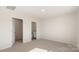 Well-lit bedroom with neutral carpet, and access to an ensuite bathroom at 4677 Fanning Rd, Hickory, NC 28602