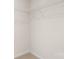 Unfinished walk-in closet with standard white wire shelving on the top and white walls at 4677 Fanning Rd, Hickory, NC 28602