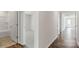 Hallway of home featuring hardwood floors and doors to the bedrooms and bathroom at 4677 Fanning Rd, Hickory, NC 28602