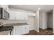 Kitchen featuring white cabinets, granite counters, and stainless appliances at 4677 Fanning Rd, Hickory, NC 28602