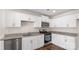 Kitchen features white cabinets, stainless steel appliances, and granite countertops at 4677 Fanning Rd, Hickory, NC 28602