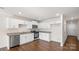Well-equipped kitchen with stainless steel appliances, granite counters, and white cabinetry at 4677 Fanning Rd, Hickory, NC 28602
