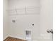Functional laundry room with shelving and hookups, blending utility with practicality at 4677 Fanning Rd, Hickory, NC 28602