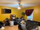 Bedroom features yellow walls, an adjustable bed with blue headboard, and light wood laminate flooring at 508 Hillcrest St, Marshville, NC 28103