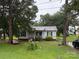 Charming single-story home featuring a well-manicured lawn and mature trees at 508 Hillcrest St, Marshville, NC 28103