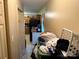 Hallway features a closet full of items and a partial view of a kitchen at 508 Hillcrest St, Marshville, NC 28103