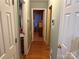 Hallway featuring multiple rooms and white doors at 508 Hillcrest St, Marshville, NC 28103