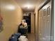Hallway features a closet full of items and a shelf with containers at 508 Hillcrest St, Marshville, NC 28103
