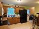 Eat-in kitchen featuring oak cabinets, linoleum flooring, and stainless steel appliances at 508 Hillcrest St, Marshville, NC 28103