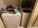 Laundry room features a white washer, white dryer, and tile flooring at 508 Hillcrest St, Marshville, NC 28103