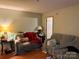Inviting living room with hardwood flooring, neutral paint and 2 couches at 508 Hillcrest St, Marshville, NC 28103