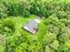 Aerial view of home surrounded by a lush green landscape, offering a tranquil and private setting at 5369 Concord Rd, York, SC 29745
