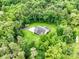 Aerial view of a house surrounded by lush greenery, offering privacy and a serene setting at 5369 Concord Rd, York, SC 29745