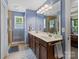Bathroom with double vanity, tile flooring, and a glass-enclosed shower at 5369 Concord Rd, York, SC 29745