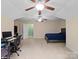 Bright, spacious bedroom offers dual fans, plush carpet, and versatile space for relaxation and entertainment at 5369 Concord Rd, York, SC 29745