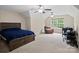 Spacious bedroom boasts vaulted ceilings, two fans, a large window, plush carpet, and a wood-frame bed at 5369 Concord Rd, York, SC 29745