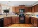 Picture of the kitchen with granite countertops, stainless steel appliances, and mosaic backsplash at 5369 Concord Rd, York, SC 29745