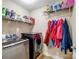 Efficient laundry room featuring modern washer, dryer, shelving, and ample storage for household needs at 5369 Concord Rd, York, SC 29745