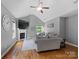 Cozy living room featuring hardwood floors, fireplace, and ample natural light at 5369 Concord Rd, York, SC 29745