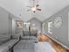 Cozy living room features vaulted ceilings, a ceiling fan, and hardwood floors at 5369 Concord Rd, York, SC 29745