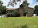 Brick house with brick chimney, plus leafy shrubs in well-kept yard at 6018 Unionville Rd, Monroe, NC 28110