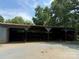 Large open-air barn with dirt floor and beams with gravel surround at 6018 Unionville Rd, Monroe, NC 28110
