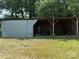 Barn with a sliding metal door on a grassy lot at 6018 Unionville Rd, Monroe, NC 28110