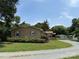 Brick home with purple shutters plus gravel driveway and sheds in backyard at 6018 Unionville Rd, Monroe, NC 28110