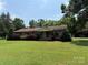 Charming single-story home with a well-manicured lawn and mature landscaping at 6018 Unionville Rd, Monroe, NC 28110