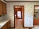 Kitchen featuring an adjoining laundry area with an open view to the hearth room at 6018 Unionville Rd, Monroe, NC 28110