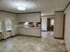 Eat-in kitchen with vintage wallpaper, neutral flooring, and a pass-through to the kitchen area at 6018 Unionville Rd, Monroe, NC 28110