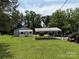 A group of sheds on a large, well-maintained green lot at 6018 Unionville Rd, Monroe, NC 28110