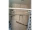 Accessible shower with a grab bar, built-in shelf, and easy-to-clean tiled walls at 6018 Unionville Rd, Monroe, NC 28110