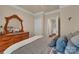 Comfortable bedroom featuring a wooden dresser, attractive bedding and neutral-toned walls at 608 Latrobe Dr, Iron Station, NC 28080