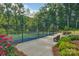 Well-maintained community tennis court surrounded by lush greenery at 608 Latrobe Dr, Iron Station, NC 28080