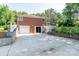 Brick home features a garage and sliding glass door to the backyard at 616 26Th Nw St, Hickory, NC 28601