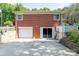 Rear view of brick home with garage and access to backyard at 616 26Th Nw St, Hickory, NC 28601