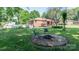 A fire pit and chairs on a spacious lawn complement the home's exterior and offer a relaxed outdoor space at 616 26Th Nw St, Hickory, NC 28601