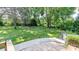 Expansive backyard features a fire pit, large tree, and lush lawn, ideal for outdoor enjoyment at 616 26Th Nw St, Hickory, NC 28601