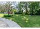 Large, shaded backyard featuring a fire pit and ample room for activities at 616 26Th Nw St, Hickory, NC 28601