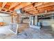 Unfinished basement features exposed wood beams, concrete floors, and visible ductwork at 616 26Th Nw St, Hickory, NC 28601