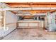 Unfinished basement with utility hookups, shelving, and concrete floors at 616 26Th Nw St, Hickory, NC 28601