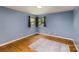This bedroom features hardwood floors and large windows for natural light at 616 26Th Nw St, Hickory, NC 28601