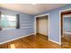 Bright bedroom with hardwood floors, built in shelves and a closet at 616 26Th Nw St, Hickory, NC 28601