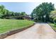 Long driveway leading to a brick home with spacious front lawn at 616 26Th Nw St, Hickory, NC 28601