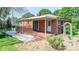 Inviting covered front porch with brick flooring, white door, and well-maintained exterior at 616 26Th Nw St, Hickory, NC 28601