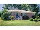 Charming brick home features a well-manicured lawn and landscaping at 616 26Th Nw St, Hickory, NC 28601